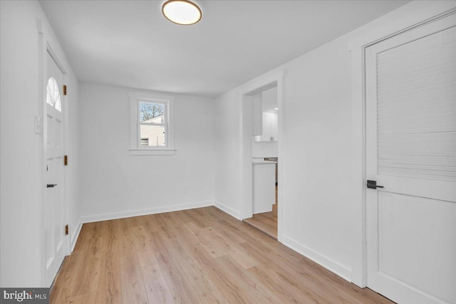 spare room with light wood-type flooring