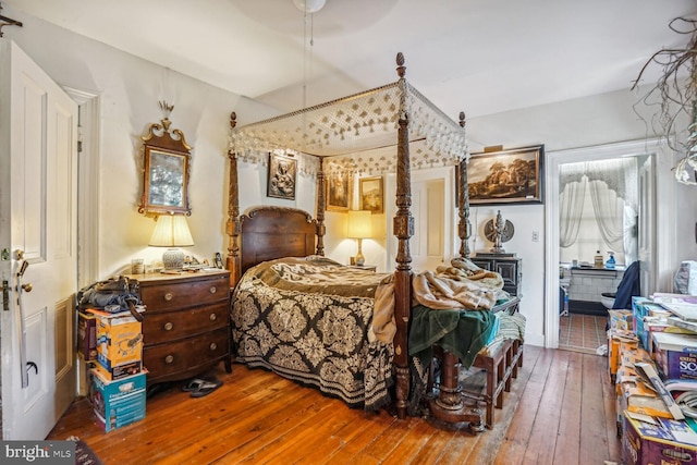 bedroom with hardwood / wood-style flooring and ceiling fan