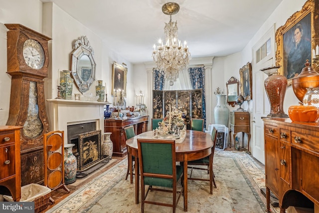 dining space with an inviting chandelier