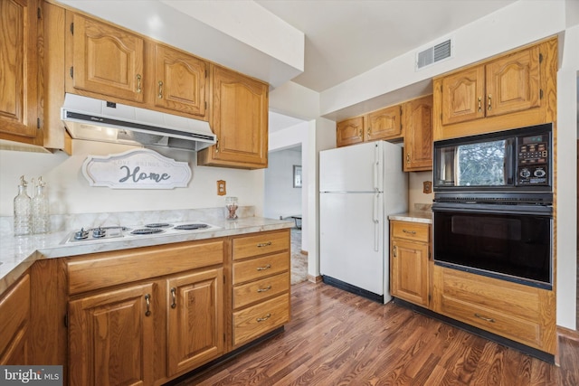 kitchen featuring dark wood-type flooring and black appliances