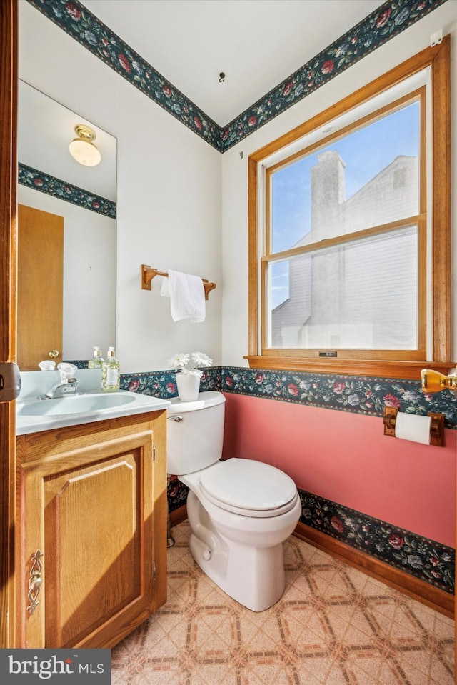 bathroom featuring vanity and toilet