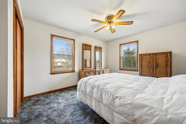 carpeted bedroom featuring ceiling fan