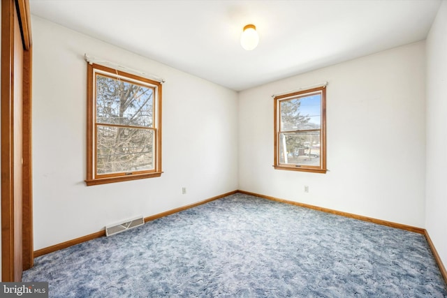 empty room with carpet flooring