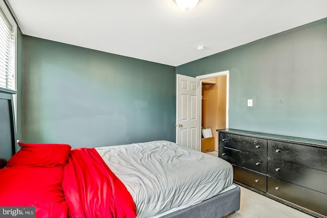 bedroom featuring light colored carpet