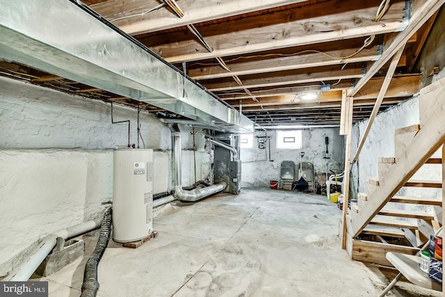 basement featuring electric water heater and heating unit