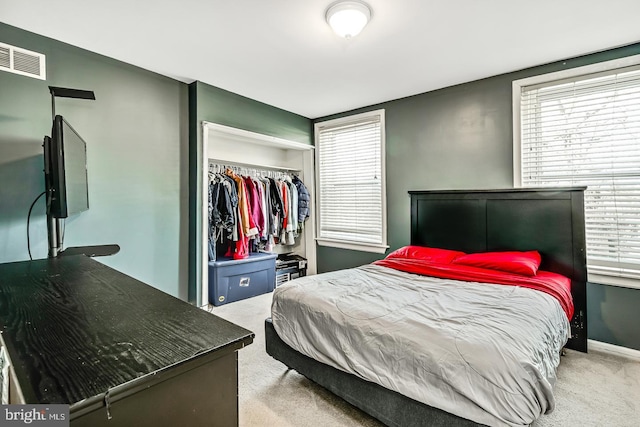 carpeted bedroom featuring a closet