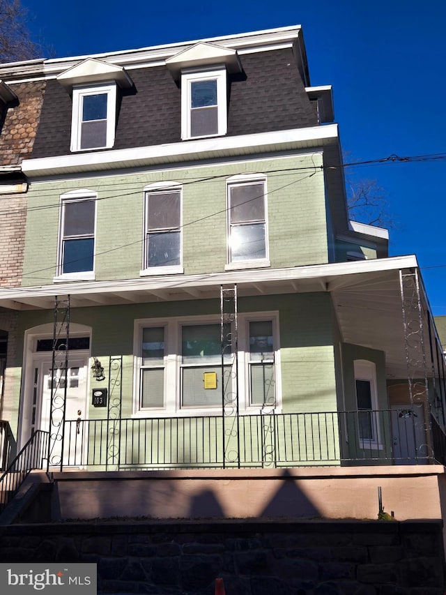 townhome / multi-family property with covered porch