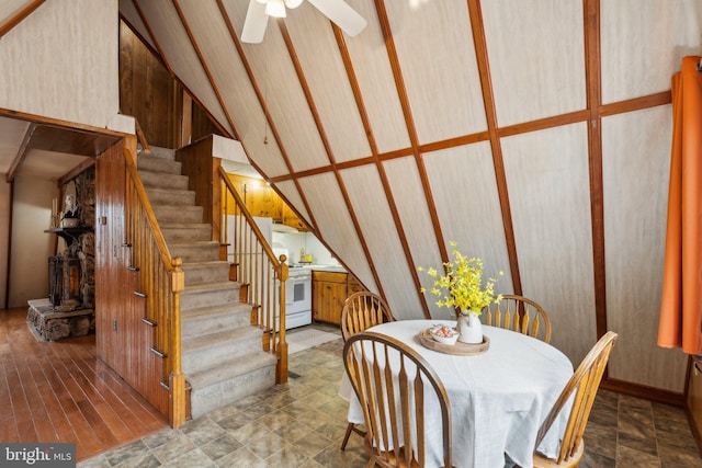 dining space with stairway and a ceiling fan