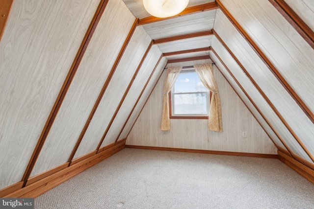 bonus room featuring carpet flooring and vaulted ceiling