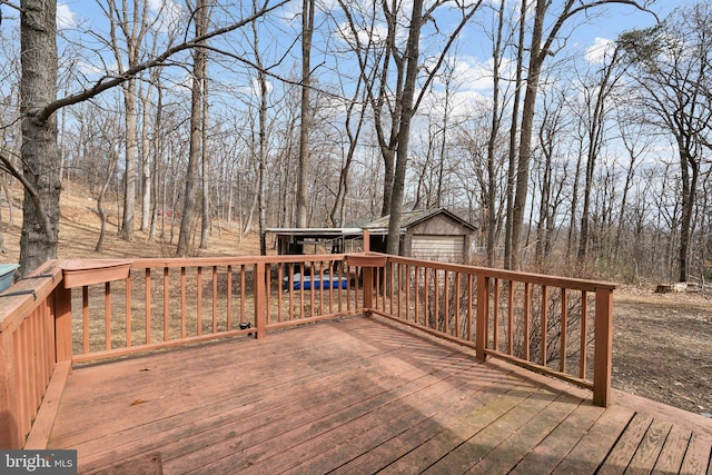 wooden terrace featuring an outdoor structure