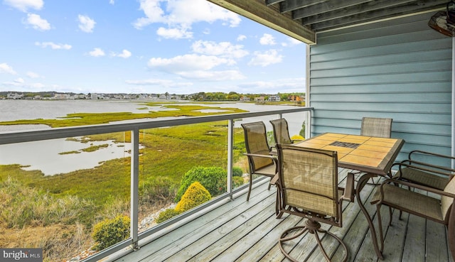 balcony featuring a water view