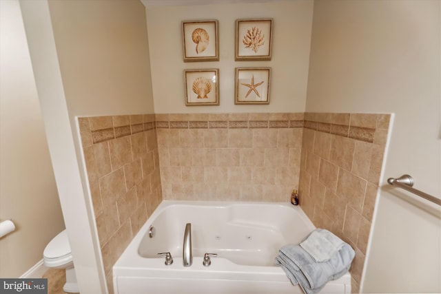 bathroom featuring a bathing tub and toilet