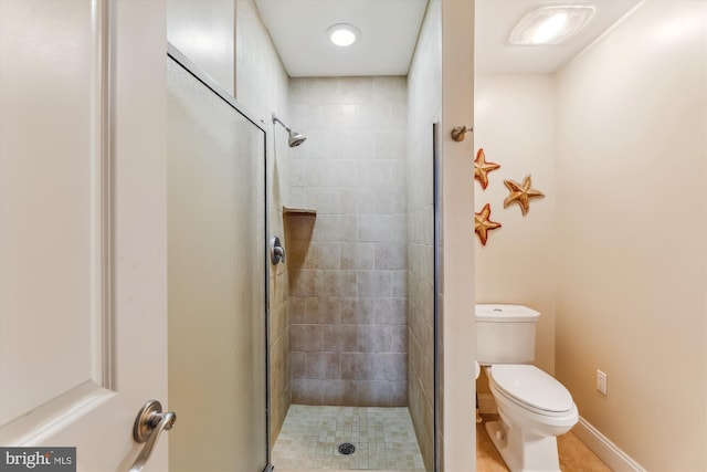 bathroom with toilet and walk in shower