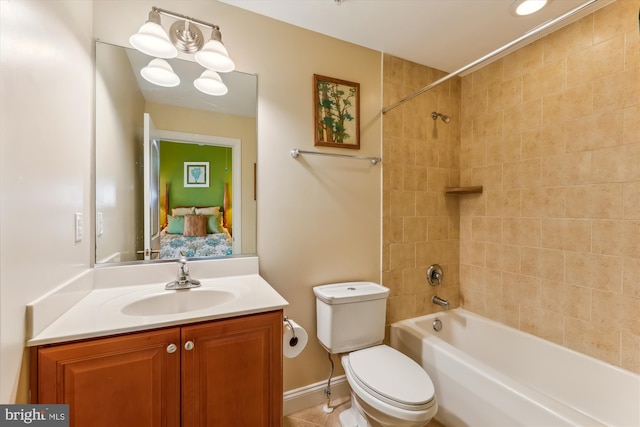 full bathroom with vanity, tiled shower / bath combo, and toilet