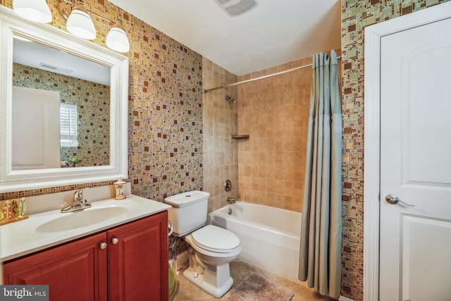 full bathroom with vanity, toilet, shower / tub combo, and tile walls