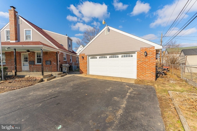 view of front of home with a garage and covered porch