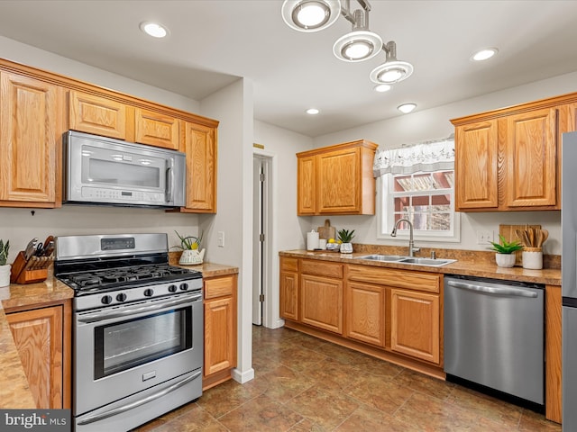 kitchen with sink and appliances with stainless steel finishes