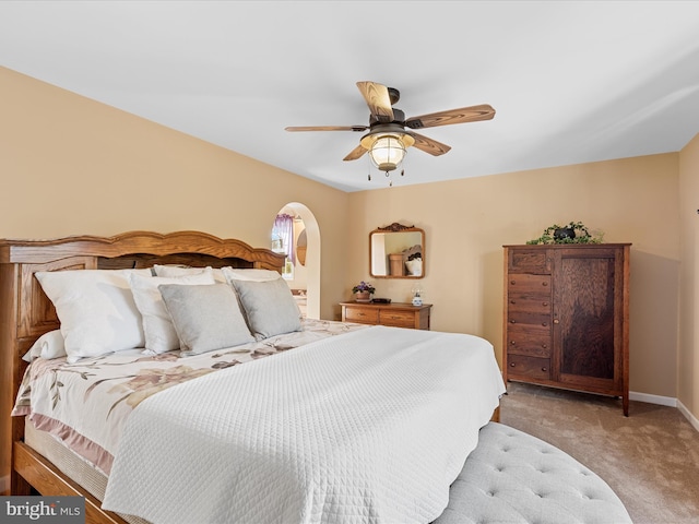 bedroom with light carpet and ceiling fan