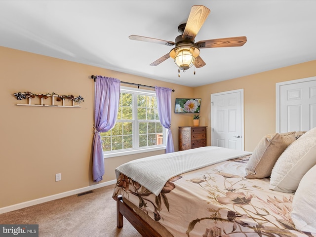 carpeted bedroom with ceiling fan