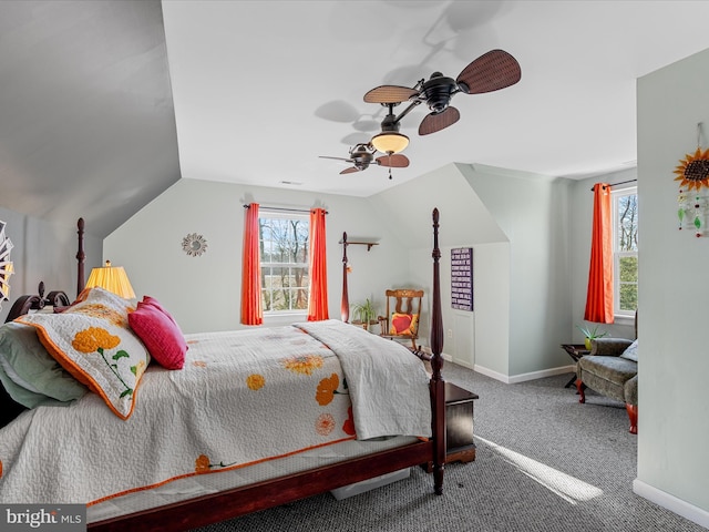 bedroom featuring multiple windows, carpet, lofted ceiling, and ceiling fan