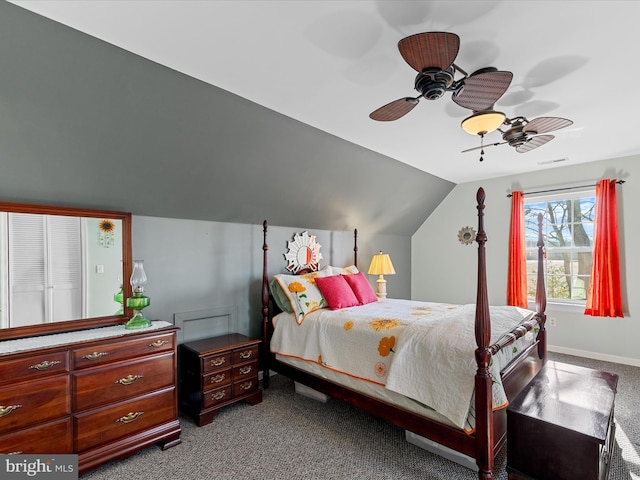 carpeted bedroom featuring lofted ceiling and ceiling fan