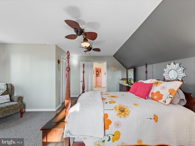 carpeted bedroom featuring vaulted ceiling and ceiling fan