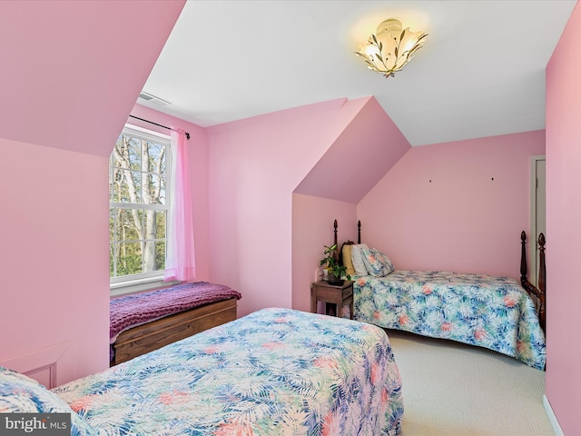 bedroom with lofted ceiling and carpet