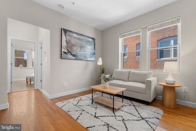 sitting room with light hardwood / wood-style floors