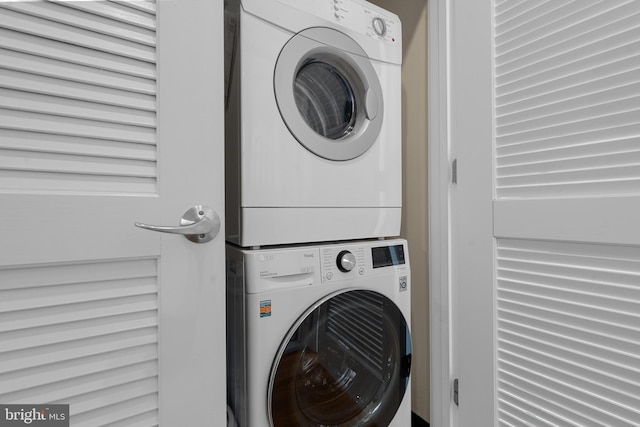 laundry area featuring stacked washer and dryer