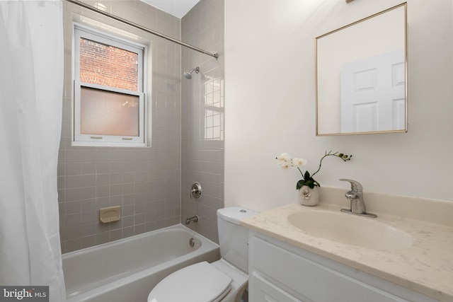 full bathroom with vanity, shower / bath combination with curtain, and toilet