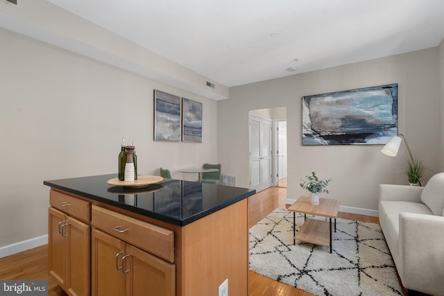 kitchen featuring light hardwood / wood-style floors and a kitchen island