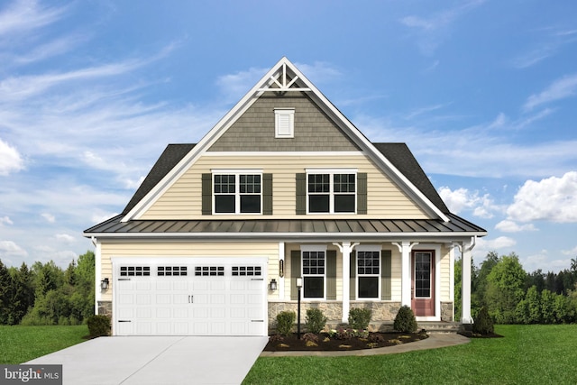 view of front of house with a garage, a front lawn, and covered porch