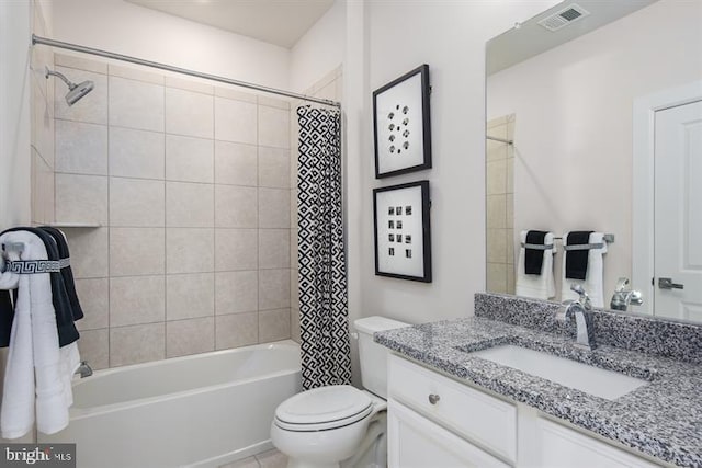 full bathroom with shower / tub combo with curtain, vanity, and toilet