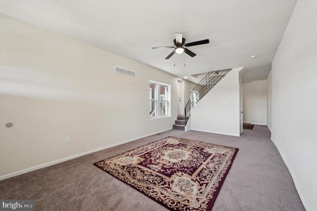 carpeted living room featuring ceiling fan