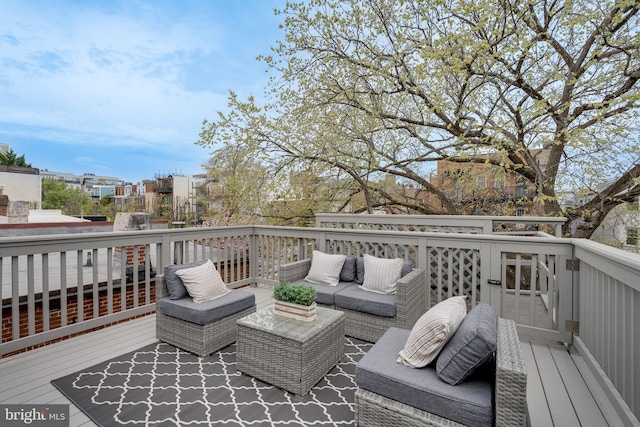 wooden terrace featuring an outdoor living space