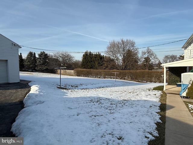 view of yard covered in snow