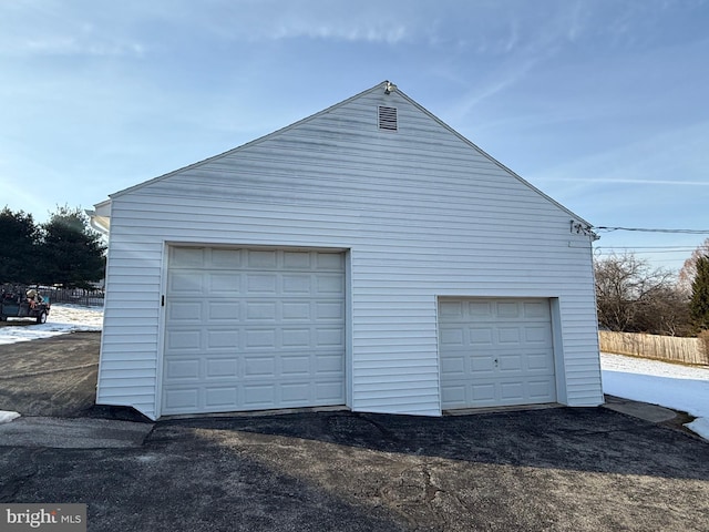 garage featuring fence