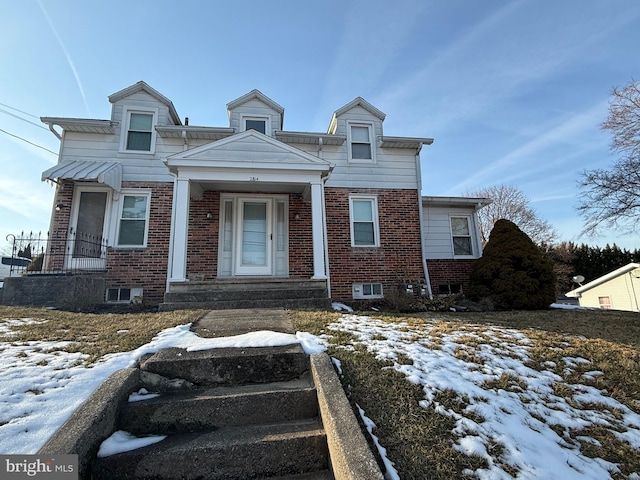 view of front of property featuring brick siding