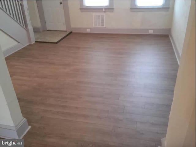 interior space featuring hardwood / wood-style flooring and a wealth of natural light