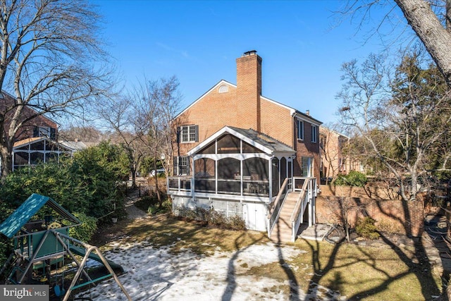 back of property featuring a sunroom