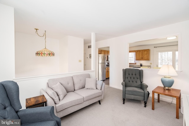 living room featuring light colored carpet