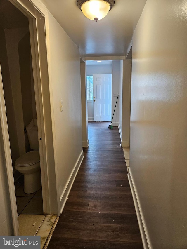 corridor featuring dark hardwood / wood-style floors