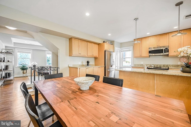 dining room featuring light hardwood / wood-style floors