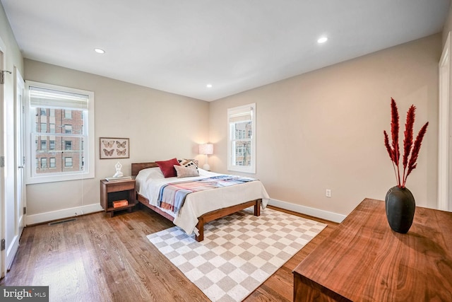 bedroom with light wood-type flooring