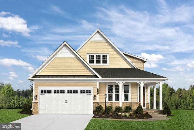 view of front of house with a garage, a front lawn, and covered porch