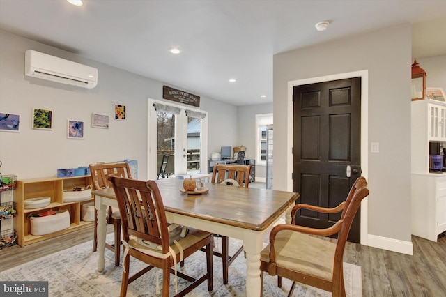 480 Natural Dam Rd, Gettysburg, PA 17325 - dining room with a wall mounted air conditioner, light wood-style floors, recessed lighting, and baseboards