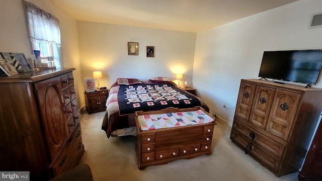 bedroom with light colored carpet