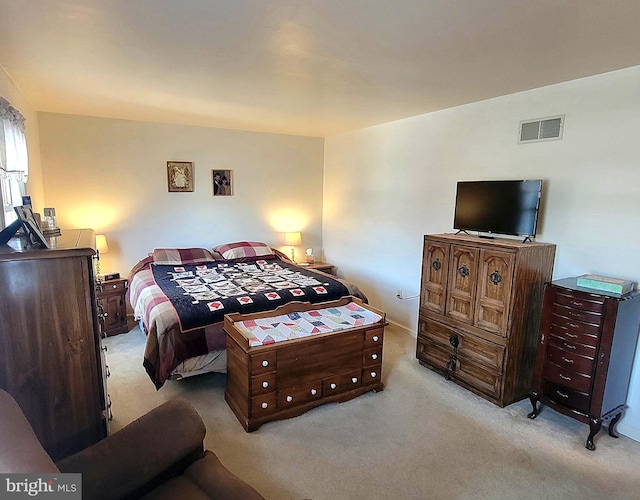 bedroom featuring light colored carpet