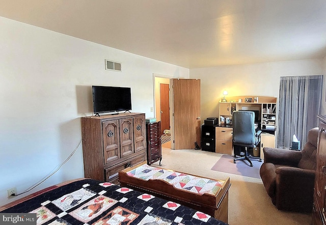 bedroom featuring light colored carpet