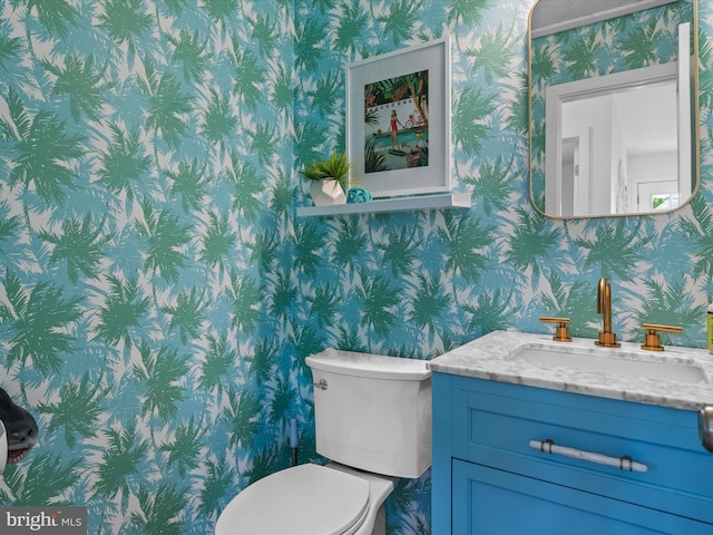 bathroom with vanity and toilet